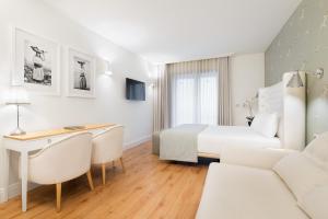 Postel nebo postele na pokoji v ubytování Eurostars Porto Douro