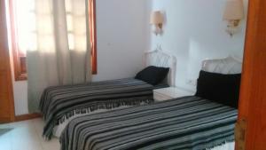 Ein Bett oder Betten in einem Zimmer der Unterkunft Bungalow Mariano 140