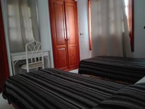 Ein Bett oder Betten in einem Zimmer der Unterkunft Bungalow Mariano 140