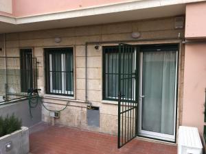 an entrance to a building with a door and windows at Cooper Apartment in Genoa