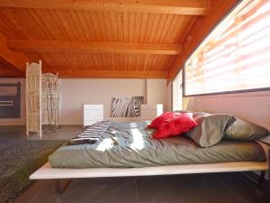 a large bed in a room with a wooden ceiling at Le Dimore Di Ponte Selce in Fondi