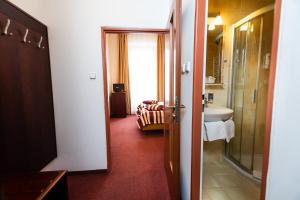Postel nebo postele na pokoji v ubytování Hotel Petr