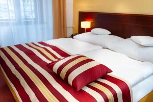 Postel nebo postele na pokoji v ubytování Hotel Petr