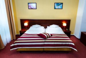 Postel nebo postele na pokoji v ubytování Hotel Petr