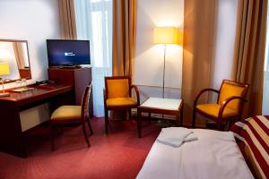 Postel nebo postele na pokoji v ubytování Hotel Petr