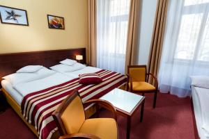 Postel nebo postele na pokoji v ubytování Hotel Petr