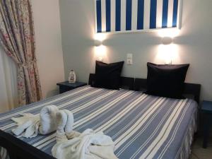 Кровать или кровати в номере Villa Bel Passo Apartments