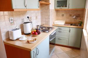 Kuchyň nebo kuchyňský kout v ubytování Apartment Marijana