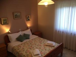A bed or beds in a room at Mikro Katafygio