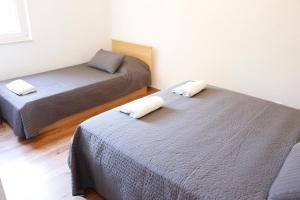 two beds in a small room with two beds at Apartment Marijana in Dubrovnik