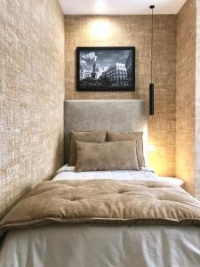 a bedroom with a large bed with a wall at BRAKKO 45 in Naples