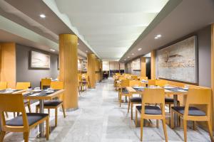 Reštaurácia alebo iné gastronomické zariadenie v ubytovaní Acta Atrium Palace