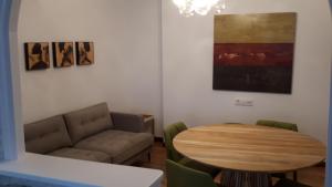 a living room with a couch and a table at PR Blanco in Santiago de Compostela