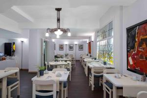 Restoranas ar kita vieta pavalgyti apgyvendinimo įstaigoje Hôtel Argus by happyCulture