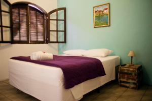 
Cama ou camas em um quarto em The House Plaza Hotel

