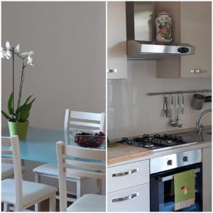 due immagini di una cucina con piano cottura e tavolo di La casa di Giò a Montesilvano