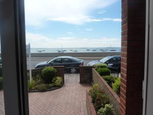 a view of two cars parked in a parking lot at WynnStay Studio Apartments in Southend-on-Sea