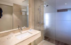 a bathroom with a sink and a shower at Oporto Airport & Business Hotel in Maia
