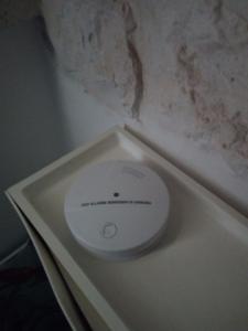 a white toilet in a corner of a room at Trulli La Gufa in Ostuni