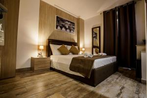A bed or beds in a room at Noemi's rooms Guest House