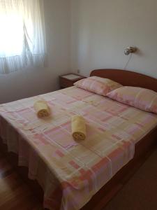 Postel nebo postele na pokoji v ubytování Apartmani Anna