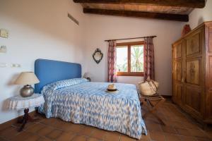 Postel nebo postele na pokoji v ubytování Agroturismo Can Feliu