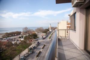 a view of a street with a lighthouse from a building at Hotel Erika in Alexandroupoli