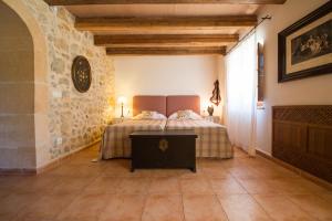 Postel nebo postele na pokoji v ubytování Agroturismo Can Feliu