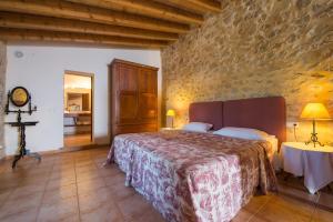 Postel nebo postele na pokoji v ubytování Agroturismo Can Feliu