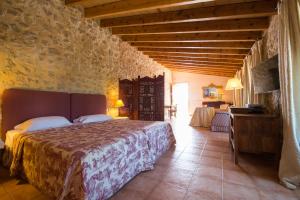 Postel nebo postele na pokoji v ubytování Agroturismo Can Feliu
