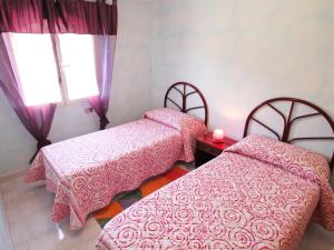 A bed or beds in a room at Holiday Home Is Molas by Interhome
