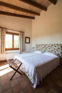 Postel nebo postele na pokoji v ubytování Agroturismo Can Feliu