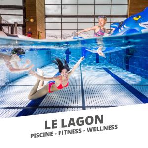 a group of children swimming in a swimming pool at Appartements résidence Roches Rouges in Tignes