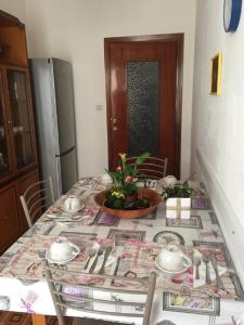 a dining room table with a table cloth on it at Casa Pierina in Alghero