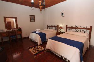Cama o camas de una habitación en Parador Monte Carmelo