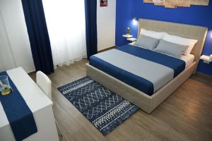 a rendering of a bedroom with a bed and a table at B&B villa brezza marina in Sant'Isidoro