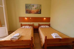 Postel nebo postele na pokoji v ubytování House Dimitri Agios Georgios Pagoi Corfu