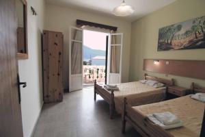 Postel nebo postele na pokoji v ubytování House Dimitri Agios Georgios Pagoi Corfu