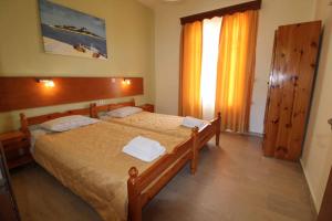 Postel nebo postele na pokoji v ubytování House Dimitri Agios Georgios Pagoi Corfu