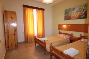 Postel nebo postele na pokoji v ubytování House Dimitri Agios Georgios Pagoi Corfu