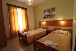 Postel nebo postele na pokoji v ubytování House Dimitri Agios Georgios Pagoi Corfu