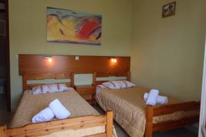 Postel nebo postele na pokoji v ubytování House Dimitri Agios Georgios Pagoi Corfu