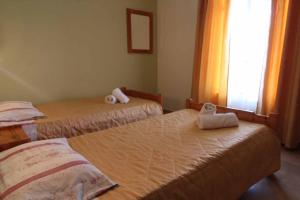 Postel nebo postele na pokoji v ubytování House Dimitri Agios Georgios Pagoi Corfu