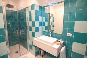 a bathroom with a sink and a shower at Casa Sorrentina in Sorrento