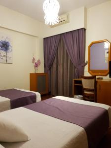 Postel nebo postele na pokoji v ubytování Ahiram Hotel Byblos