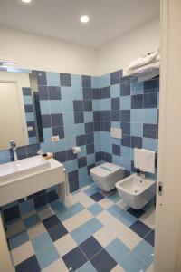 a bathroom with a sink and a toilet at Casa Sorrentina in Sorrento