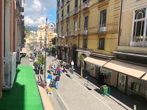 a group of people walking down a city street at Casa Sorrentina in Sorrento
