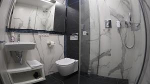Kúpeľňa v ubytovaní Hotel Sjesta