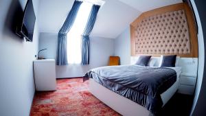 Posteľ alebo postele v izbe v ubytovaní Hotel Sjesta