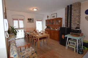 a kitchen with a table and a dining room at B&B al Capitello in Trento